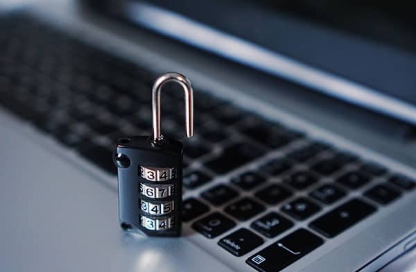 open padlock on computer keyboard